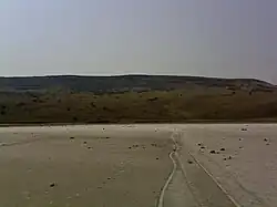 Вид с озера Чокрак на гору Ташкалак и входы в каменоломни Ташкалак-1