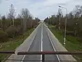 Вид с моста узкоколейной железной дороги на Киевское шоссе в сторону Санкт-Петербурга