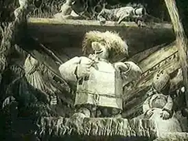 Сцена из мультфильма. В центре — главный герой