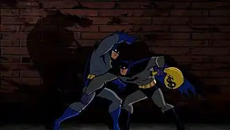 Бэтмен (слева) против Оулмена (справа)