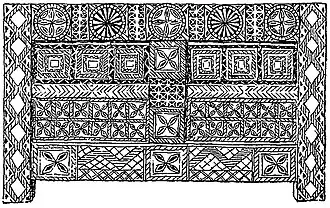 Амбар в селении Терти с резным орнаментом. На лицевой стороне изображены петроглифы.