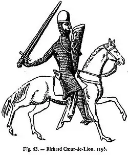 Король Ричард Львиное Сердце. Длинная кольчуга, длиной порой до колен, с рукавами полной длины и разрезами на подоле спереди и сзади (чтобы садиться на коня). Как правило, к ней в комплекте шли кольчужные чулки. А в варианте, известном как хауберк, имелся кольчужный капюшон, составляющий с ней единое целое. В других вариантах мог иметься отдельный кольчужный капюшон.