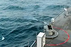 Стрельба из 25-мм АУ Mk.&nbsp;38 Mod.&nbsp;2; USS&nbsp;Mount Whitney (LCC-20), 2018&nbsp;год.