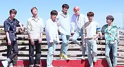 BTS posing for the camera while outdoors