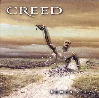 Обложка альбома Creed «Human Clay» (1999)