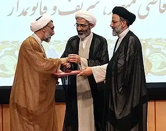 Ибрахим Раиси (справа) и Мостафа Пурмохаммади (слева), два члена комитета «Судьи смерти», 2013 год