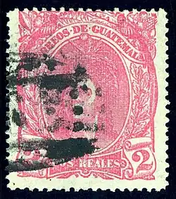 2 реала&nbsp;(Sc #12), погашенная овальным номерным почтовым штемпелем «6» (в Кесальтенанго)