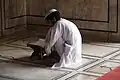 Чтение Корана.