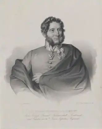 Sepia print labeled JOS FRIEDR FREIHERR V PALOMBINI shows a man with mutton-chop sideburns. He wears a light gray military uniform and is wrapped in a darker cloak.