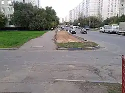 Улица Корнейчука в месте, где её пересекает забранная в подземный коллектор река Чермянка