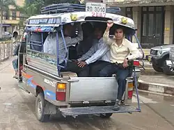 Маршрутное такси (грузовой мотороллер) в Лаосе.