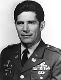 A black and white image showing the head and shoulders of Rocco in his military dress uniform with ribbons.