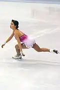 Фигуристка присела, через мгновение будет прыжокМира Льюнг, Skate America 2006