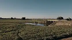 Мост через ерик к северу от села