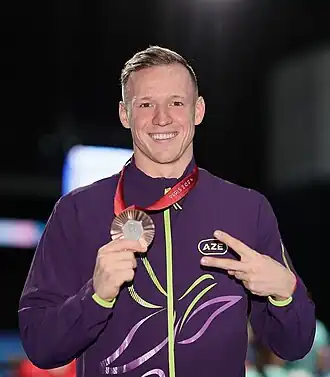 Роман Салей с бронзовой медалью на церемонии награждения плавания на 100 метров вольным стилем (S12)