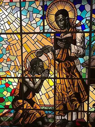Карл Луанга крестит Кизито. Витраж в базилике Муньоньо, Уганда