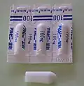 Ректальные суппозитории (в индивидуальных полимерных упаковках и вскрытый) со 100 мг ацетаминофена в каждом (Япония)
