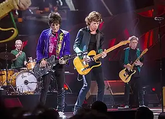 The Rolling Stones во время выступления на фестивале Summerfest[англ.] в Милуоки, 2015 годСлева направо: Чарли Уоттс, Ронни Вуд,  Мик Джаггер и Кит Ричардс