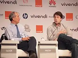 Мэйсон (справа) на форуме E-G8 в Париже, 2011