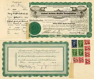 Сертификат United Artists Studio Corporation на 999 акций по 100 долларов каждая, выпущенная 4 сентября 1929 года Мэри Пикфорд-Фэрибэнкс и подписанная ею на обороте в оригинале (нижнее изображение)