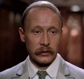 Виктор Проскурин в роли Вожеватова в фильме «Жестокий романс» (1984)