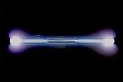 Glass tube shining bluish-violet