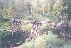 Разрушенный мост Межогской узкоколейной дороги через Ёртым