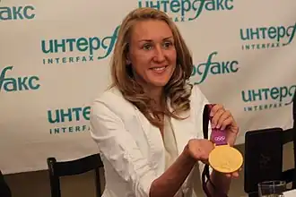 С олимпийской медалью 2012 г.